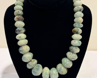 Chrysoprase Graduated Faceted Beaded Necklace, measuring 20" 

The clasp is not marked, however; it appears to be sterling. 