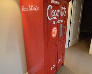 Wood cabinet painted to resemble a Coke machine