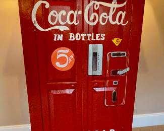 Wood cabinet painted to resemble a Coke machine
