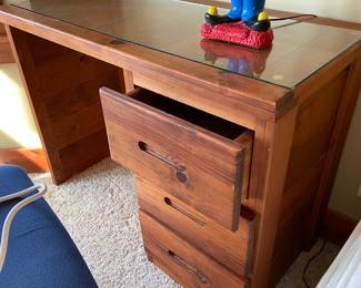 Matching wood desk with 3 drawers.