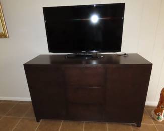 TV and stand/media storage.