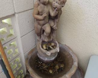 Cherub concrete water feature.