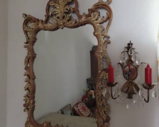 Sconce and gold gilted mirror.