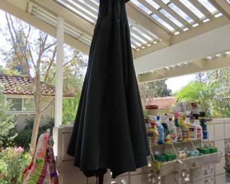 Red and blue patio umbrellas with stands.