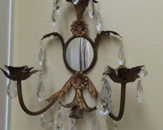 Two crystal sconces.