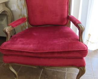 Single red velvet chair.