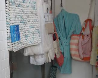Bathroom mats, robes, shower curtains with rods and hooks.