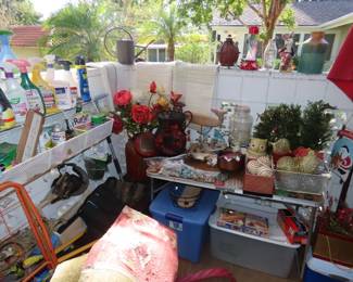 More Christmas, yard decor, pots, plant food, yard tools.