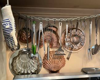 Lot 132 | Wall Of Utensils & Copper Molds
