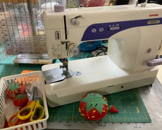 Janome Sewing Machine. Needles, thread, scissors, sewing rulers. 