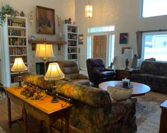 Sofa Table, Sofa, books, painting over the mantle are available. 