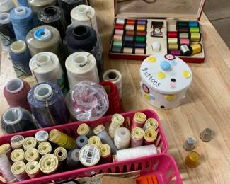 All purpose sewing machine thread, sewing kits, wooden thread wall holders.  