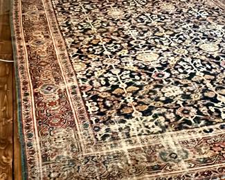 This rug is beautiful despite being worn & has a hole as well