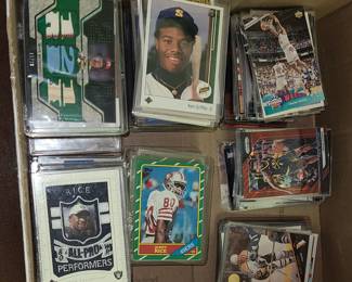 Tons of baseball, basketball, football, hockey and non sport trading cards including a Jerry Rice rookie card and Ken Griffey Jr Rookie card and many other hall of fame and future HOF players!
