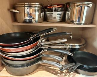 Lots of gently used pots and PANS --- a few cast iron skillets too