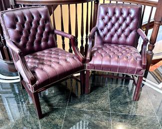 Two traditional burgundy color, leather armchairs