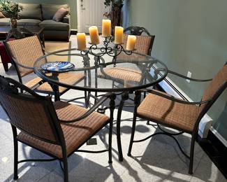 Round outdoor glass and metal table with 4 chairs