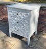 Three Drawer Gray Painted Bedside Table With Geometric Fretwork Decoration
