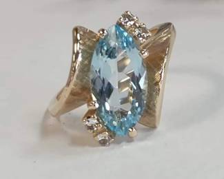 Blue Topaz marquise shape with white side accents gold size 5.75