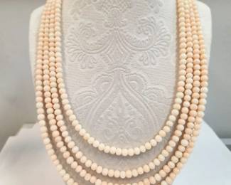 Coral multi stand with cabachon coral yellow gold clasp