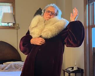 A beautiful plum colored coat with attachable collar