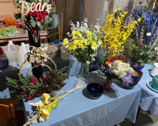  faux flowers in vases and decorations.