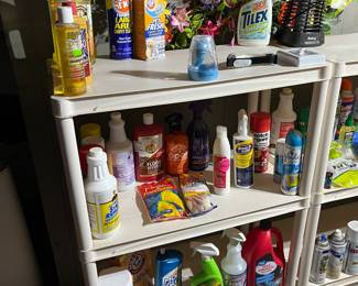 Large variety of cleaning products and decorative wreaths.