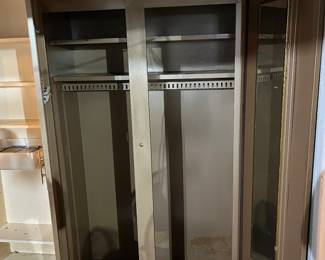 Metal two door standalone closet with both doors open.