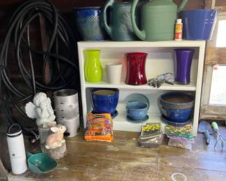 Bird food, lawn hose, flower bulbs, planters and garden art.