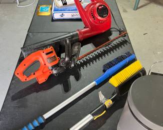 Toro electric blower, black n decker electric trimmer, garbage can, snow brushes, AC unit winter cover and umbrellas. 