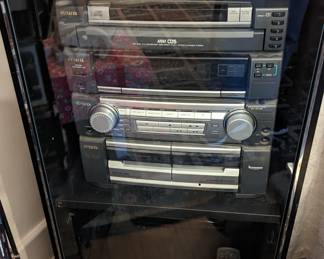 AIWA stereo system in display case.