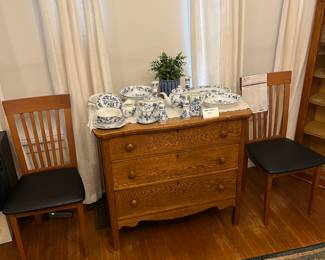 3 drawer oak chest displaying Danube serving bowls, salt n pepper, cream n sugar, gravy boat, tea pot, platters and pair of matching mission style chairs.