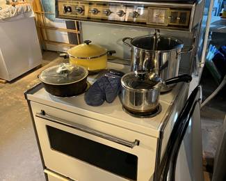 Working tappan  electric stove displaying broiler pans, stock pans and Wagner steel deep frying pan.