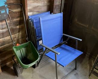 Set of four folding deck chairs.