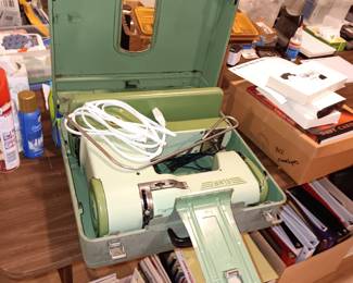 Sewing machine in metal case