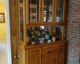 Lights up/remove the top and use as a sideboard or server/mount the top on the wall as a bar.