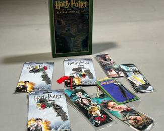 (8PC) HARRY POTTER LOT | Collectible items, including a boxed copy of The Half Blood Prince, three keychains, and four bookmarks. -  w. 6.5 x h. 9.75 in (book)
