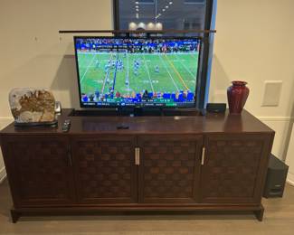 Custom made mahogany cabinet with hydraulic lift for TV (purchased separately). 