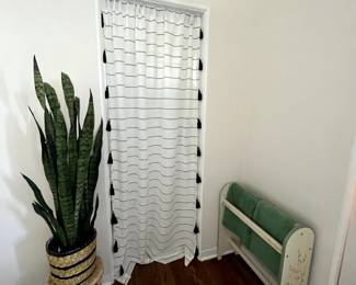 Variety of light filtering curtains, towel rails and plant stands
