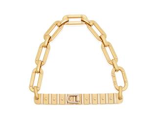 22
A Gold Bracelet
The bracelet is designed as a stylized buckle in 18K yellow and white gold, with Italian hallmarks.
33.89 grams
8" L
Estimate: $1,200 - $1,500