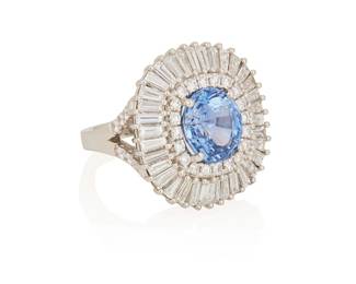 58
A Sapphire, Diamond And Platinum Ring
Set with an oval-shaped sapphire measuring 10.74 x 9.86 x 7.05 mm and weighing 6.25 carats, surrounded by 40 baguette-shaped diamonds weighing approximately 2.75 carats, further enhanced with 32 round brilliant-cut diamonds weighing approximately .76 carat, set in platinum.

Accompanied by GIA report number 2223379857 stating that the sapphire is of Sri Lankan origin, with no indications of heat treatment.
22.40 grams
Size: 6
Estimate: $5,000 - $7,000
