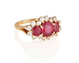 155
A Ruby And Diamond Ring
Set with an oval-shaped ruby measuring approximately 8.06 x 6.02 x 3.50 mm and weighing approximately 1.36 carats, flanked by a cushion-shaped ruby on either side, one measuring approximately 5.44 x 5.06 x 3.42 mm and weighing approximately .75 carat, the other measuring approximately 5.46 x 4.73 x 3.30 mm and weighing approximately .68 carat, surround by 16 round brilliant-cut diamonds weighing approximately .80 carat, in 18K gold.

Accompanied by AGL report no. 1134019 stating that the rubies are of Burmese origin, with no indications of heat treatment.
4.7 grams
Ring Size: 4 1/4
Estimate: $6,000 - $8,000
