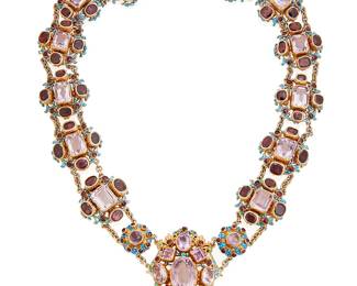 99
An Austro-Hungarian Amethyst, Garnet, Turquoise And Enamel Silver Gilt Necklace
The Baroque style necklace centers a shield-shaped plaque featuring an oval-shaped amethyst measuring approximately 18.03 x12.96 x 10.11 mm and weighing approximately 12.57 carats, a pear-shaped amethyst measuring approximately 11.86 x 9.02 x 5.43 mm and weighing approximately 3.09 carats, three oval-shaped amethysts measuring approximately 8.86 x 6.84 x 4.54 mm and weighing a total of approximately 4.38 carats; the rest of the necklace set with 12 emerald-cut amethysts weighing a total of approximately 15.63 carats; further enhanced by 56 oval-shaped garnets weighing a total of approximately 47.04 carats, the center plaque and clasp set with 13 tiny turquoise cabochons, completed with blue and white enamel, in silver gilt. Accompanied by the original fitted box.
155.56 grams
18" L / Center plaque: 2" L / Link: 1" L
Estimate: $3,000 - $5,000