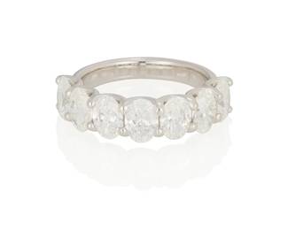 222
A Diamond Ring
Set with 7 oval-shaped diamonds weighing 3.36 carats, mounted in platinum.
7.2 grams
Size: 6
Estimate: $7,000 - $10,000