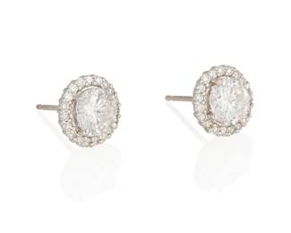 213
A Pair Of Diamond Stud Earrings
Each set with a round brilliant-cut diamond weighing approximately 1.00 carat for a total diamond weight of approximately 2.00 carats, surrounded by a total of 40 round brilliant-cut diamonds weighing approximately .40 carat, set in 18K white gold.
2 pieces
2.8 grams
3/8" Dia.
Estimate: $2,000 - $3,000