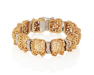 103
A Gold And Diamond Openwork Bracelet
Designed as a series of openwork links with white gold spacers set with 40 single-cut diamonds weighing a total of approximately .40 carat, in 18K white and yellow gold.
78.7 grams
2 1/4" Dia.
Estimate: $4,000 - $6,000
