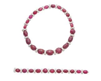 193
A Set Of Ruby And Diamond Jewelry, Seaman Schepps
The convertible necklace is set with 21 oval cabochon-cut rubies weighing approximately 208.95 carats, highlighted with 63 round brilliant-cut diamonds weighing approximately 9.45 carats. The bracelet is set with 11 oval cabochon-cut rubies weighing approximately 69.96 carats, highlighted with 33 round brilliant-cut diamonds weighing approximately 2.31 carats, signed Seaman Shepps, set in Platinum.

147.70 grams
2 pieces.
Bracelet: 7 1/2" L, Necklace: 15" L
Estimate: $25,000 - $35,000