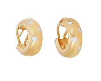 150
A Pair Of "Etoile" Diamond, Platinum And Gold Earrings, Tiffany & Co.
Designed as half hoops set with eight round brilliant-cut diamonds weighing a total of approximately .32 carat, in platinum and 18K gold, signed Tiffany & Co.
2 pieces
14.30 grams
3/4" L x 1/4" W
Estimate: $500 - $700