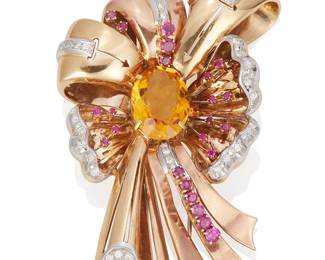 178
Retro Citrine Ruby, Diamond, And Gold Brooch
The Retro brooch centers an oval cut citrine measuring 20.68 x 14.90 mm, highlighted by 25 circular-cut rubies weighing approximately 1.42 carats and 38 round brilliant-cut diamonds weighing approximately 1.14 carats, set in 14K yellow and rose gold, circa1940s.
68.21 grams
3 1/4" H x 2 1/4" W
Estimate: $3,000 - $5,000