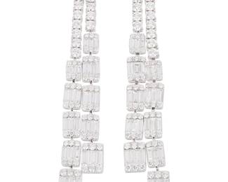 190
A Pair Of Diamond Earrings
Set with 154 round brilliant-cut diamonds weighing 3.05 carats and 76 baguette-shaped diamonds weighing 2.31 carats, mounted in 18K white gold.
2 pieces
17.30 grams
2 1/2" H x 3/8" W
Estimate: $7,000 - $10,000